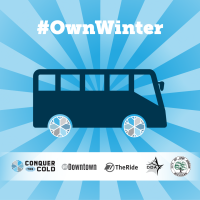 Bus with wheels in shades of blue and gray. #OwnWinter logos for Conquer the Cold, TheRide, getDowntown, Ann Arbor DDA and City of Ann Arbor